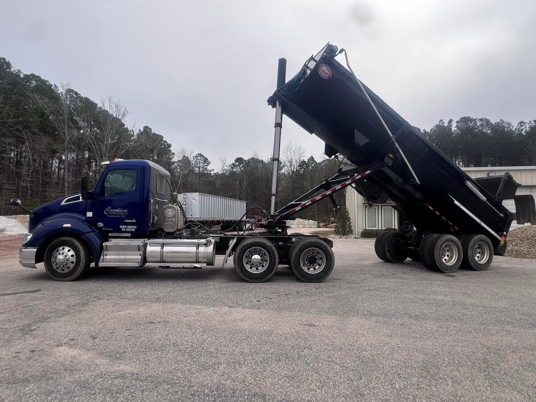 Carolina Landscape Supplies tractor and dump trailer delivering bulk material
