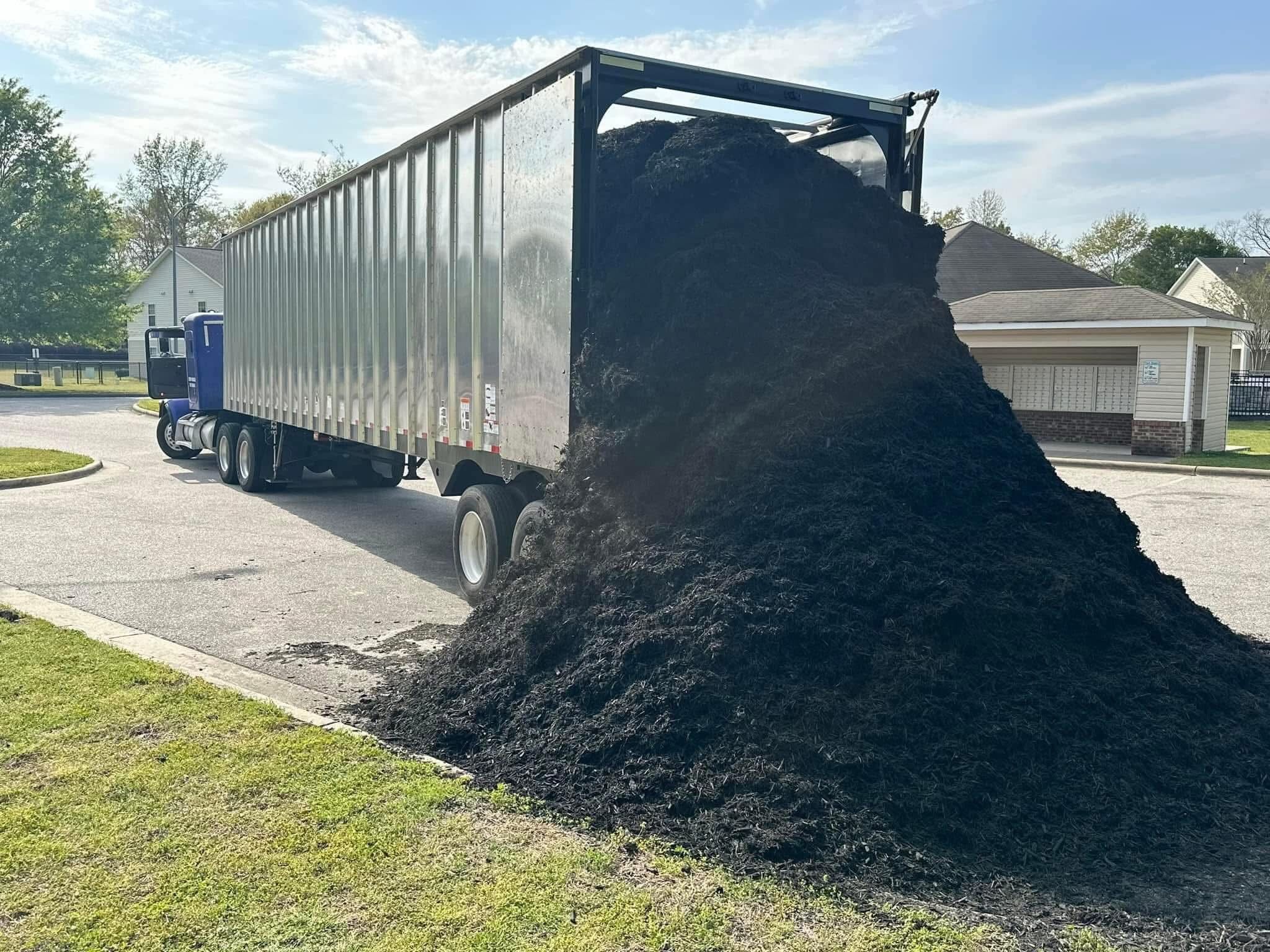 Full tractor trailer load of bulk mulch being delivered