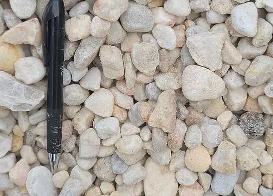 White Gravel ⅞ inch size shown beside a pen for scale